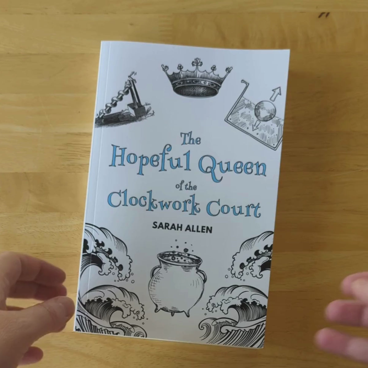 A video of hands flipping through the Hopeful Queen of the Clockwork Court. Mostly text with some black and white sketches scattered throughout